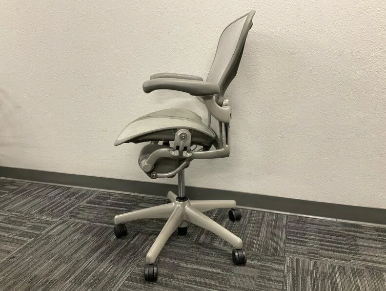 Used Herman Miller Aeron chair, side view showing tilt mechanism