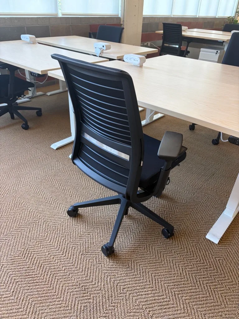 Steelcase Think chair at light-wood height-adjustable desks ready for delivery