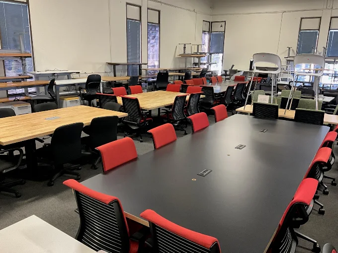 Large commercial conference table with integrated power and data outlets at BT Express Liquidators, San Jose