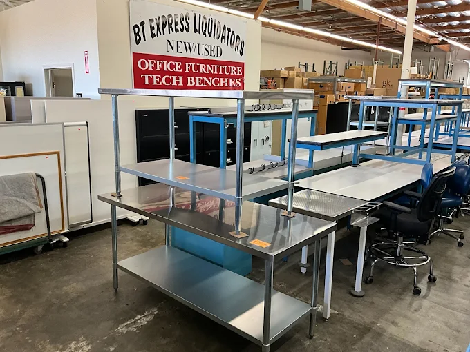 Stainless steel NSF work tables in the BT Express Liquidators warehouse, San Jose