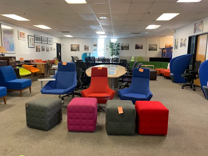 BT Express Liquidators showroom floor in San Jose with lobby seating and meeting tables